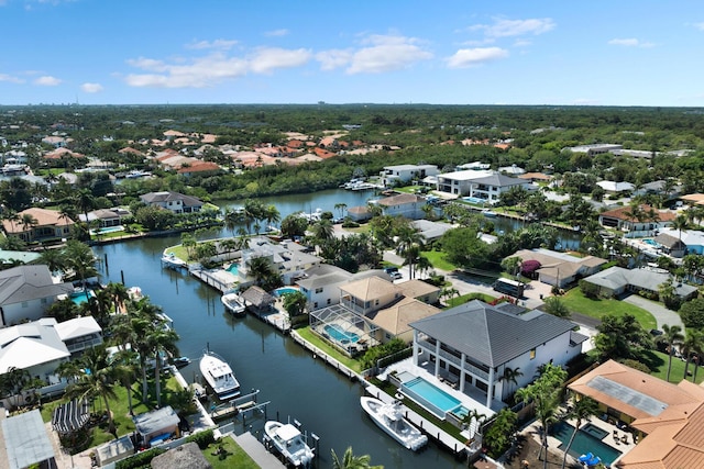 drone / aerial view featuring a water view and a residential view