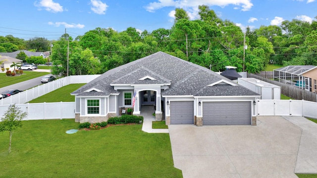 view of front of home featuring a garage and a front lawn