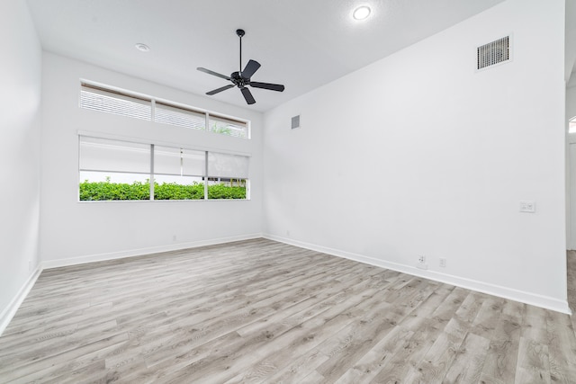 unfurnished room featuring light wood-type flooring and ceiling fan