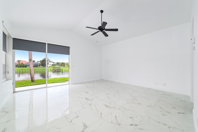 empty room featuring lofted ceiling, a water view, and ceiling fan