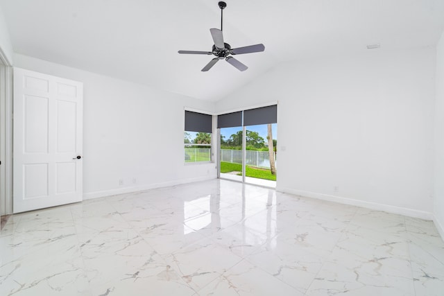 spare room featuring lofted ceiling and ceiling fan