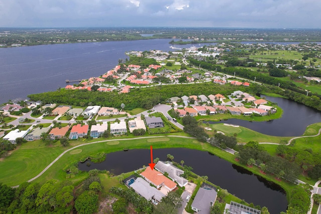 birds eye view of property featuring a water view