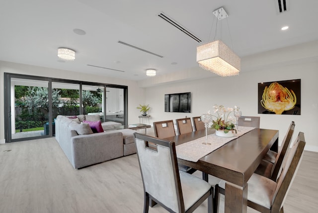 dining space featuring light wood-type flooring