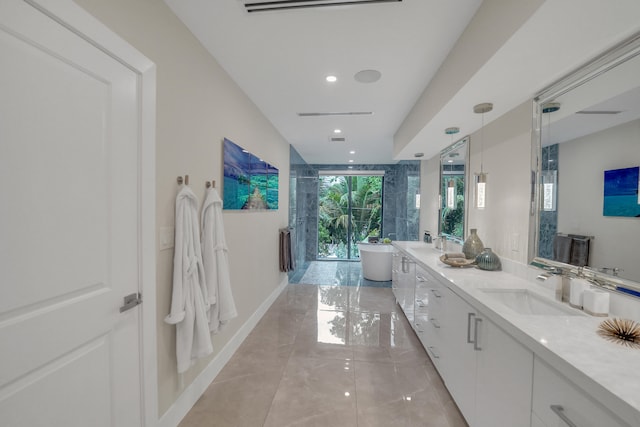 bathroom with vanity and shower with separate bathtub