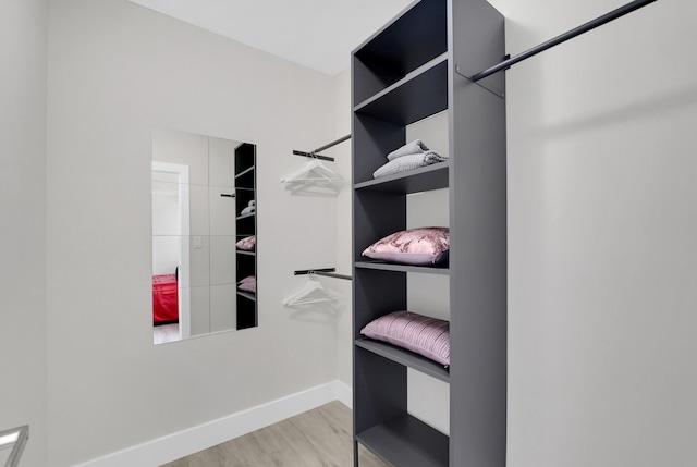 walk in closet featuring light hardwood / wood-style floors