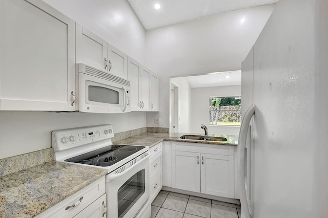 garage featuring water heater and washer and clothes dryer