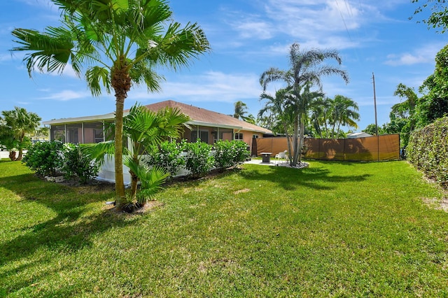 view of yard with a sunroom