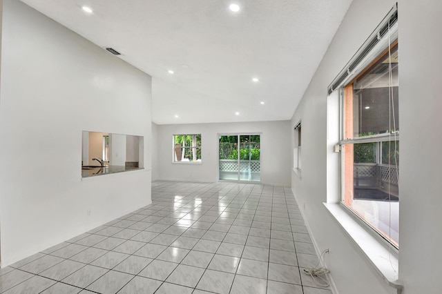 unfurnished room featuring a textured ceiling, light wood-type flooring, and ceiling fan