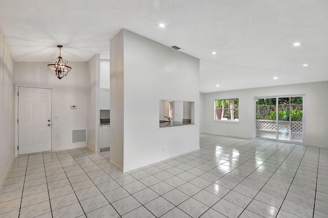 unfurnished room featuring light hardwood / wood-style flooring, a textured ceiling, and ceiling fan