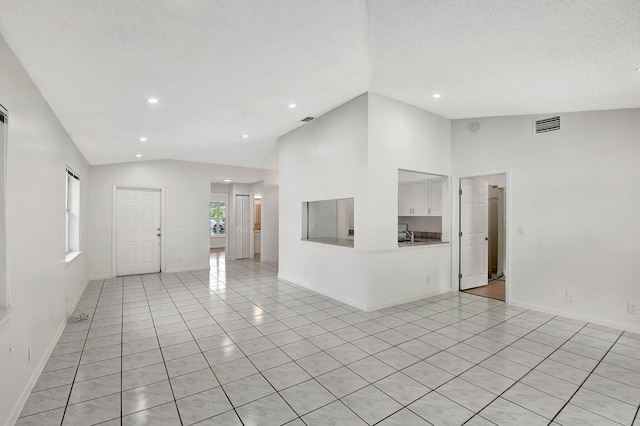 empty room featuring light hardwood / wood-style floors, a textured ceiling, and ceiling fan