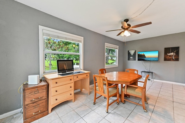 dining space with ceiling fan and light tile patterned floors