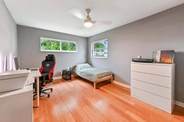 bedroom featuring ceiling fan and light hardwood / wood-style flooring