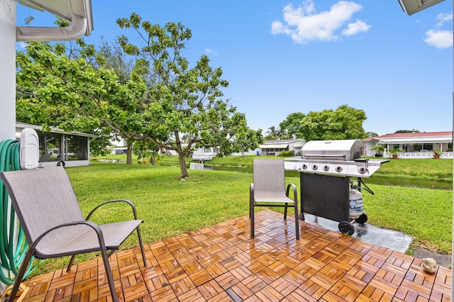 view of patio / terrace featuring area for grilling and a sunroom