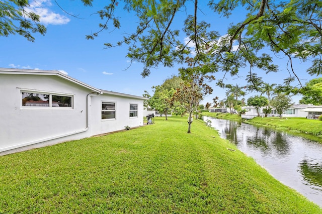 view of yard with a water view