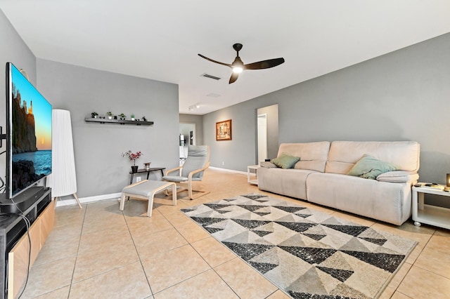 tiled living room with ceiling fan