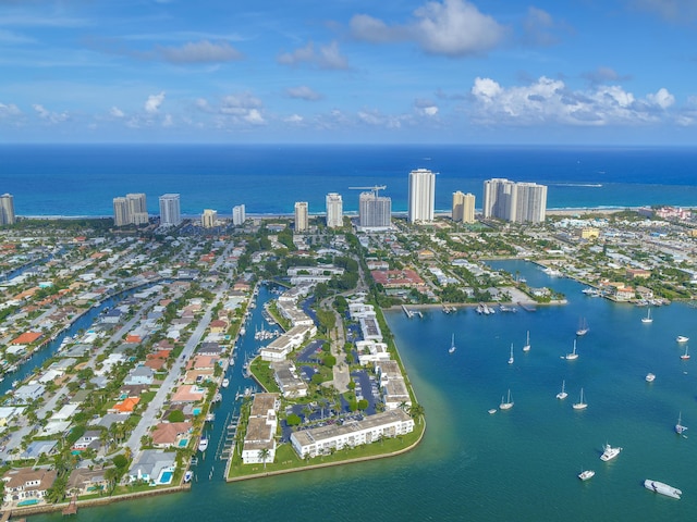 bird's eye view featuring a water view and a city view