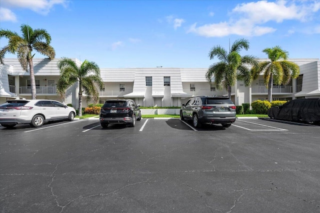 uncovered parking lot with a residential view