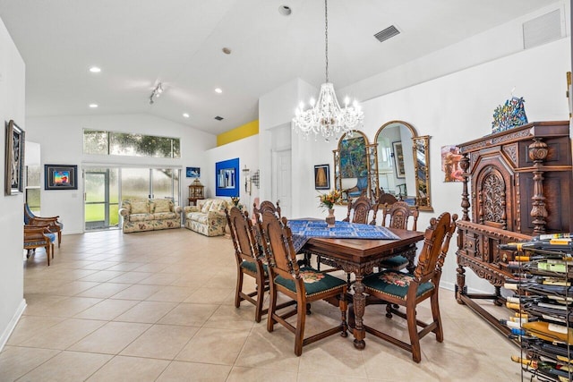 tiled dining room featuring an inviting chandelier and high vaulted ceiling