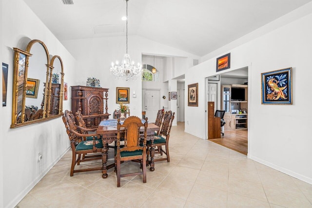 dining room with vaulted ceiling, light tile patterned floors, and a notable chandelier