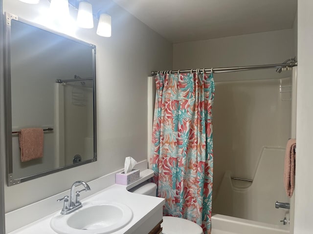 full bathroom featuring vanity, shower / bathtub combination with curtain, and toilet