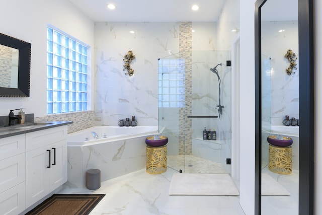 bathroom featuring vanity, a marble finish shower, recessed lighting, a garden tub, and marble finish floor