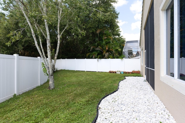 view of yard with a fenced backyard