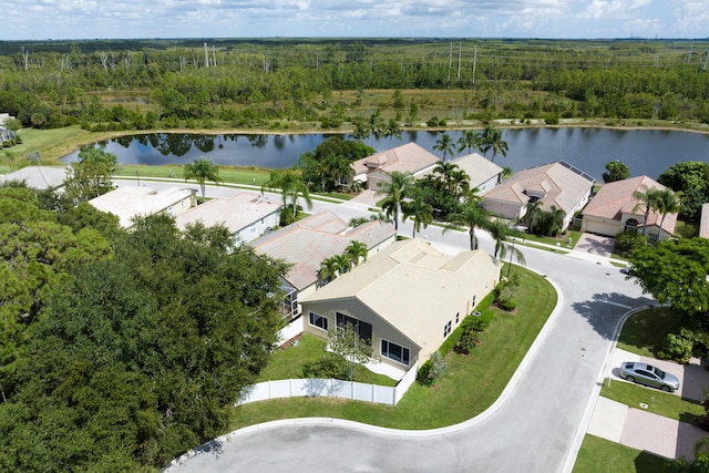 drone / aerial view featuring a residential view and a water view