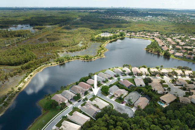 bird's eye view featuring a water view and a residential view