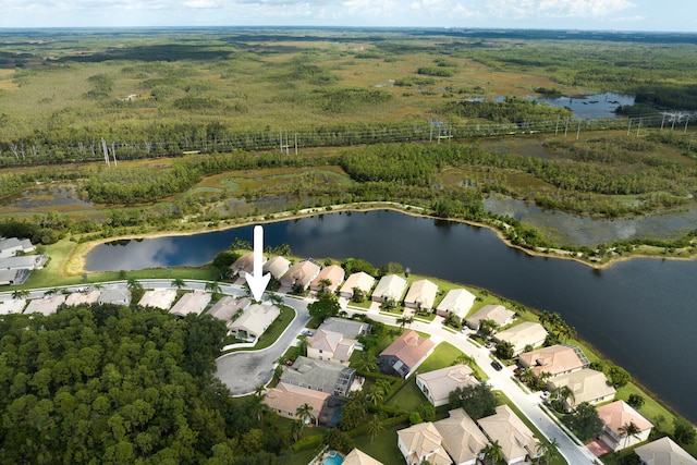 bird's eye view featuring a residential view and a water view