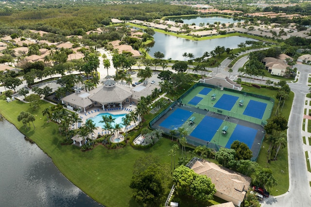 birds eye view of property with a water view