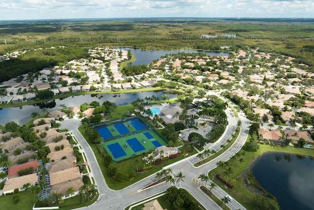 birds eye view of property with a water view and a residential view