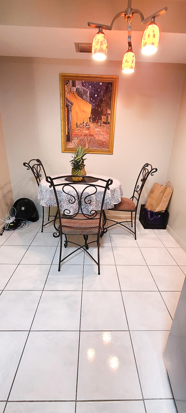 dining area with light tile patterned flooring