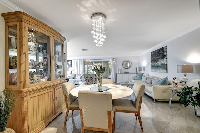 dining room featuring a chandelier and ornamental molding