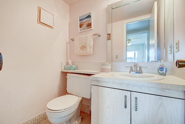 bathroom with tile patterned floors, vanity, and toilet