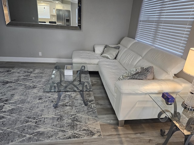 living room with wood finished floors and baseboards