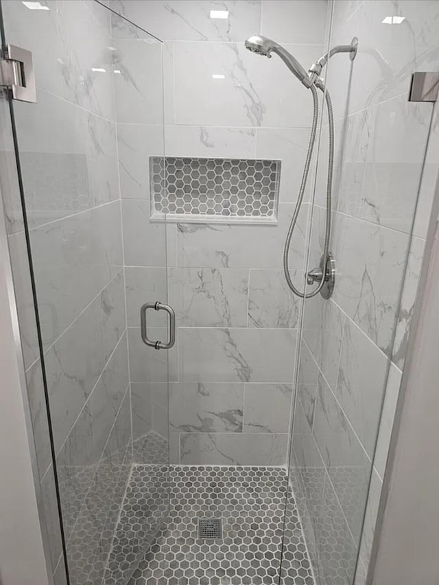 bathroom featuring a shower stall