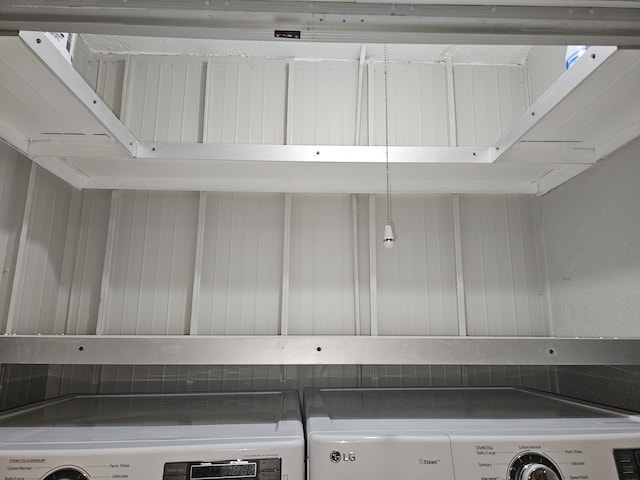 interior space featuring stainless steel countertops and independent washer and dryer