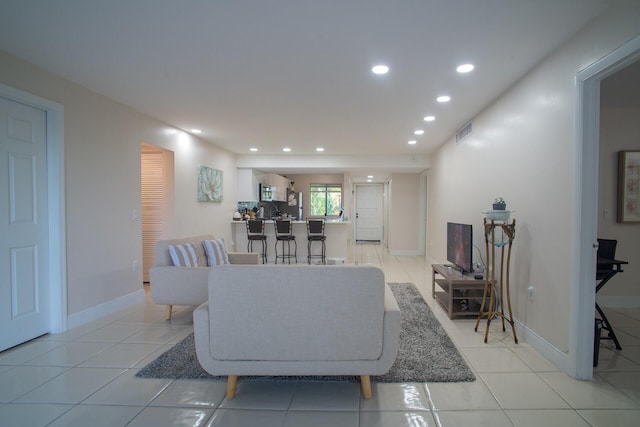 living room featuring light tile patterned flooring