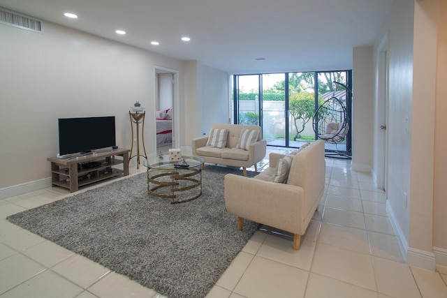 tiled living room with floor to ceiling windows