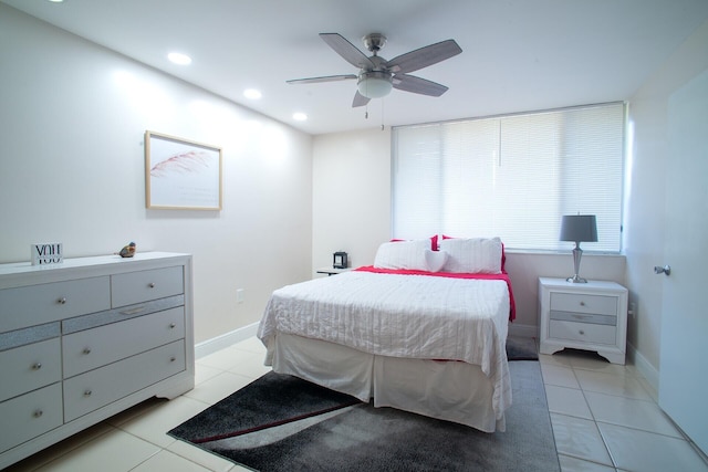 bedroom with ceiling fan and light tile patterned flooring