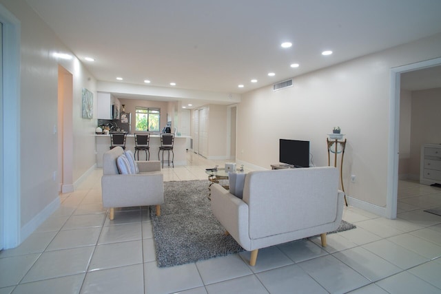 living room featuring light tile patterned flooring