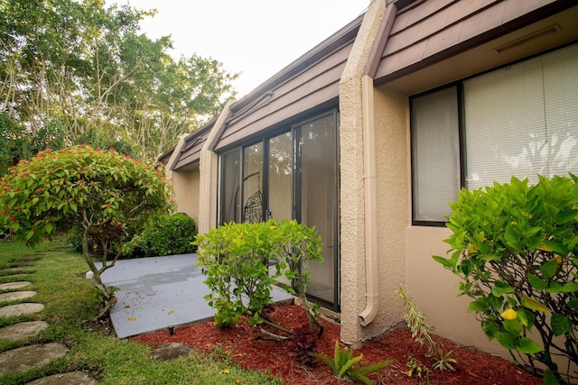 view of side of home featuring a patio