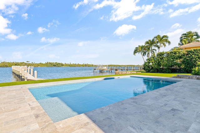 view of swimming pool with a water view, a patio, and a boat dock