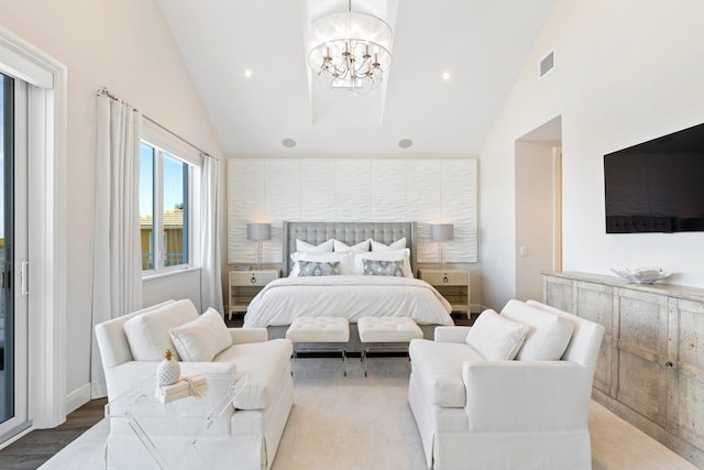 bedroom featuring light hardwood / wood-style flooring, a notable chandelier, and high vaulted ceiling