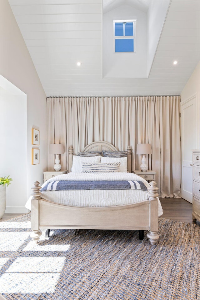 bedroom featuring vaulted ceiling and hardwood / wood-style flooring