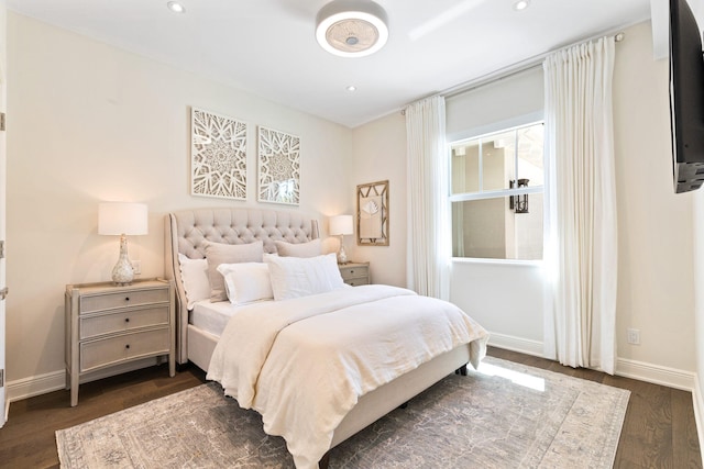 bedroom featuring dark hardwood / wood-style flooring