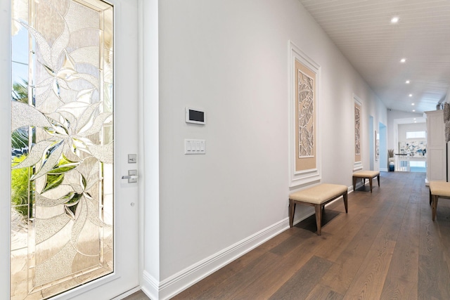 corridor with dark wood-type flooring