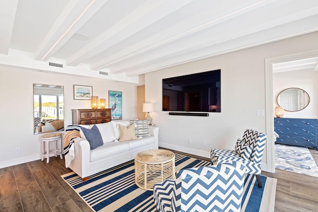 living room with beamed ceiling and dark hardwood / wood-style floors