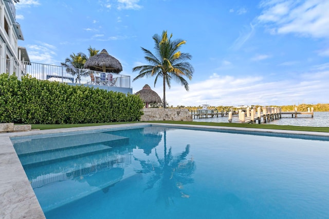 view of swimming pool with a water view and a gazebo