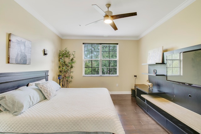 bedroom featuring crown molding, dark hardwood / wood-style flooring, and ceiling fan